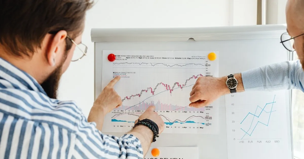 Section graphic: business leaders analyzing performance metrics to measure ROI